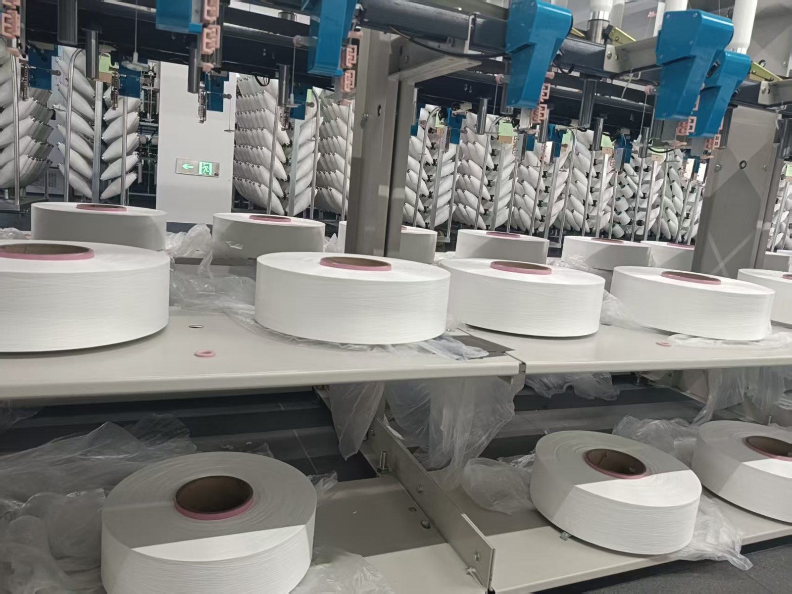Polyester filament yarn packages on texturing machines at ANKU, Suzhou